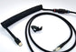 black coiled usb wire