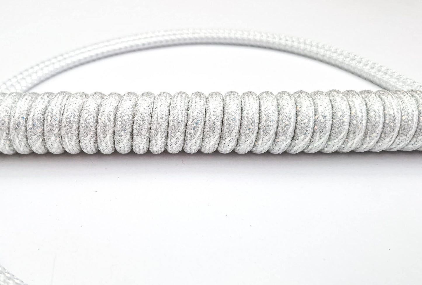 white shiny coiled cable